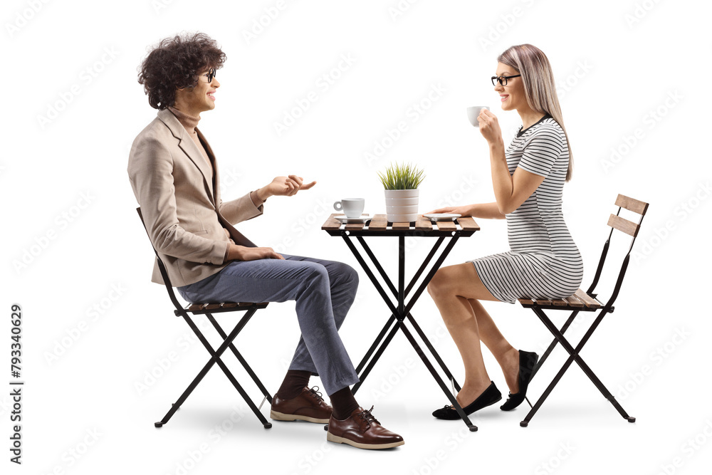 Young man and woman having coffee and talking Young man and woman having coffee and talking