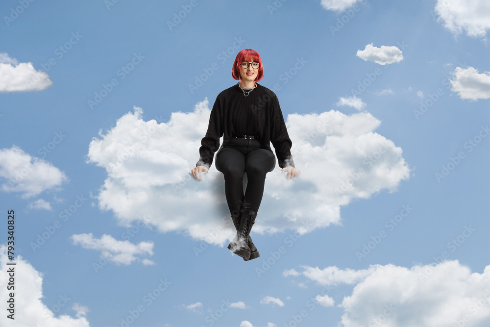 Woman with red hair and glasses sitting on a cloud Woman with red hair and glasses sitting on a cloud