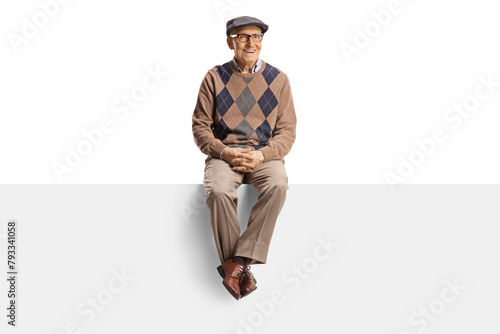 Pensioner sitting on a blank panel and looking at camera