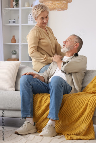 Mature couple holding hands...