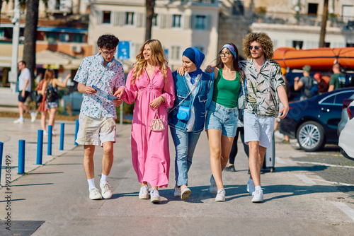 A diverse group of tourists, dressed in summer attire, strolls through the tourist city with wide smiles, enjoying their sightseeing adventure