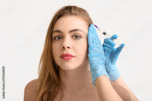 Young woman receiving fille...