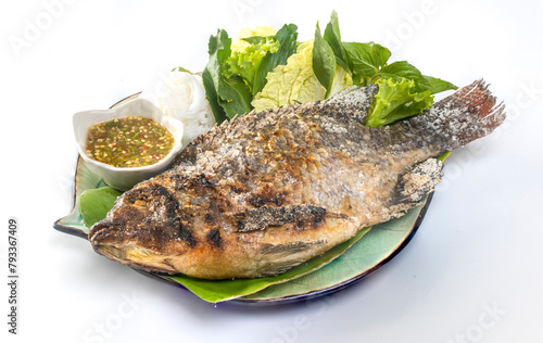 Tilapia grilled with vegetable isolate on white