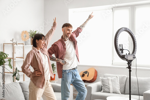 Happy young couple dancing ...