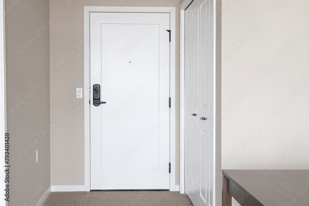 Interior door with door lever. Apartment door with deadbolt lock.