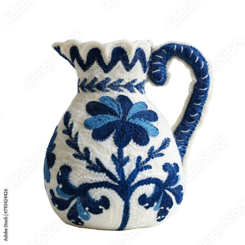 A charming wool pot holder crafted in a delightful pitcher shape featuring a lovely blue and white design is presented against a transparent background photo