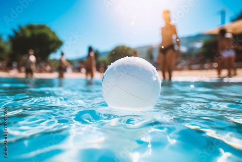 A white volleyball is floating in the water