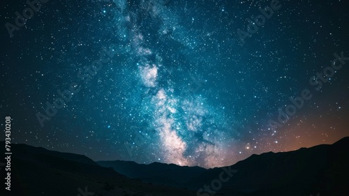 Starry night sky over mountain landscape - Breathtaking view of the Milky Way sprawling across the night sky above silhouetted mountainous terrain