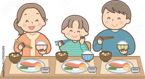 笑顔で食事をする家族
