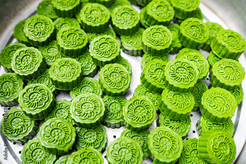 Green mugwort cake in steamer photo
