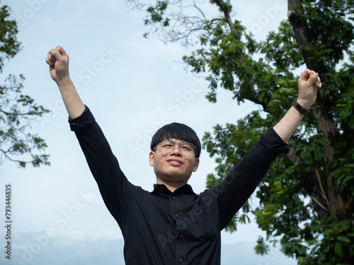 Businessman male man boy gentleman person people cheerful pointing finger happy hand arm body part raise enjoyment celebration summer building success carefree expression strategy business vitality  photo