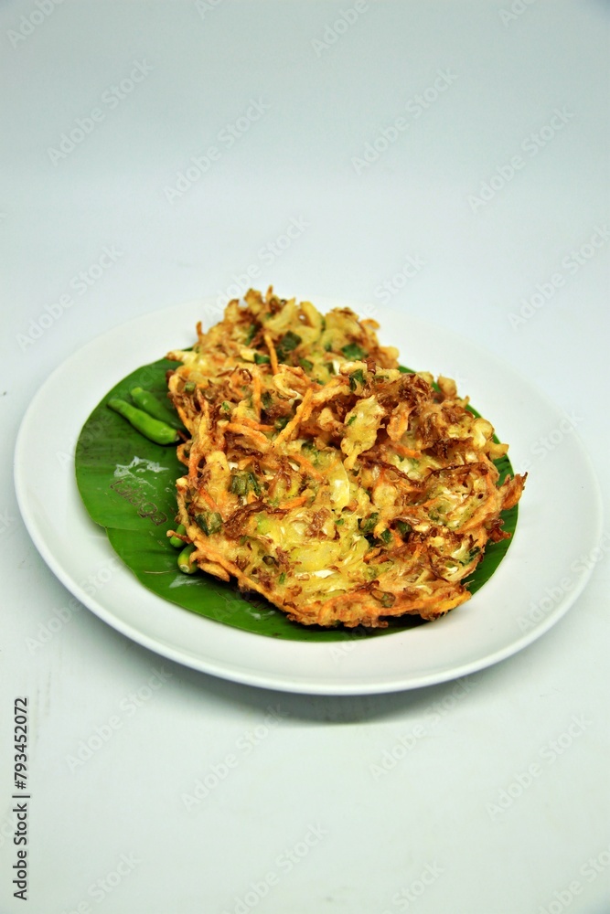 Bala-bala is one of the favorite snacks of West Javanese. This food is better known as bakwan. made from a mixture of wheat flour dough with several types of sliced carrots and cabbage and then fried. Bala-bala is one of the favorite snacks of West Javanese. This food is better known as bakwan. made from a mixture of wheat flour dough with several types of sliced carrots and cabbage and then fried.