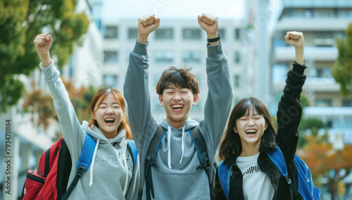 Japanese people are celebrating passing their exams, cheering with joy and holding up fists in excitement.