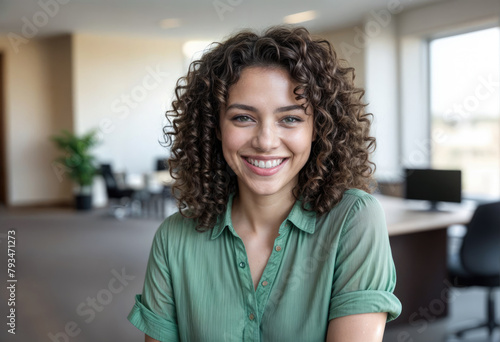 Young Woman with Curly Dark Hair Smiling in Close-up