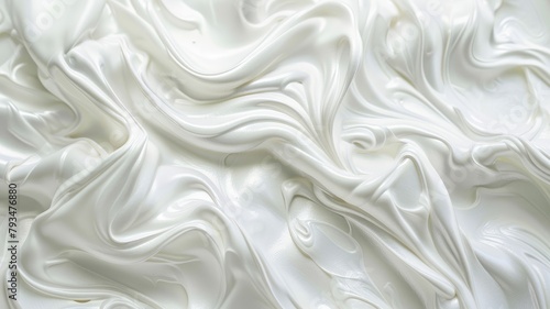 Close-up image of white creamy texture with smooth peaks and swirls