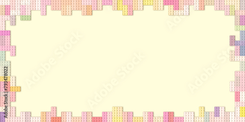 Colored toy plastic bricks frame background.