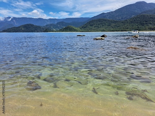 Wallpaper Mural Pelado Island in Paraty, mountains in the background,sky with clouds, large rocks, and calm sea. Natural swimming pool and warm water Torontodigital.ca