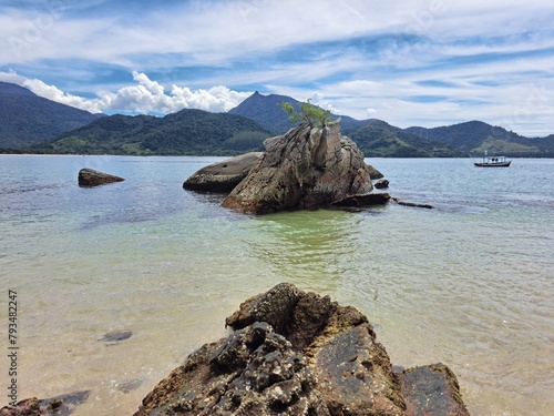 Wallpaper Mural Pelado Island in Paraty, mountains in the background,sky with clouds, large rocks, and calm sea. Natural swimming pool and warm water Torontodigital.ca