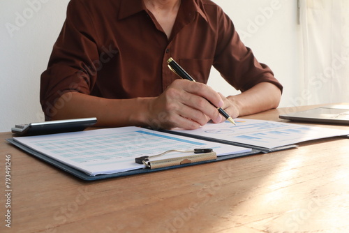 businessman, male, has insurance documents. Insurance helps him protect things. Documents are papers with information. He keeps them safe. Important for safety and security