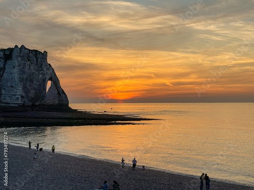 Sunset at Etretat with view of a beach and chalk cliff. France