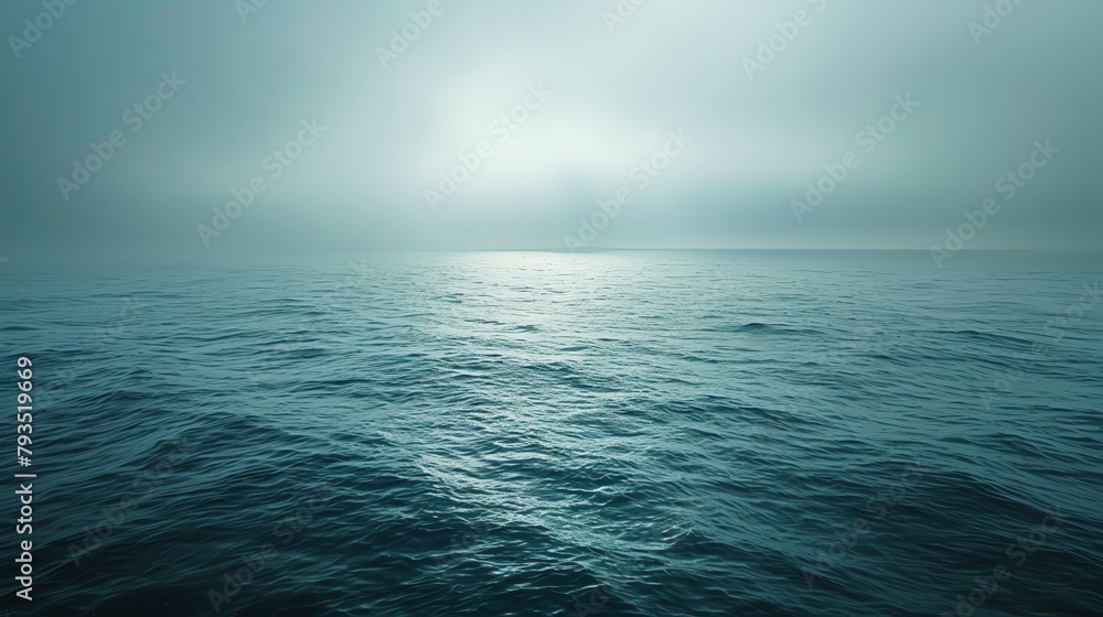 Obraz premium Serene ocean view under a muted sky, conveying the echoing silence of nature, vast waters reflecting the stillness and solitude