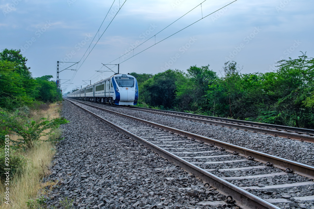 Fototapeta premium The Solapur Mumbai Vande Bharat Express Train heading towards Mumbai, near Pune India.