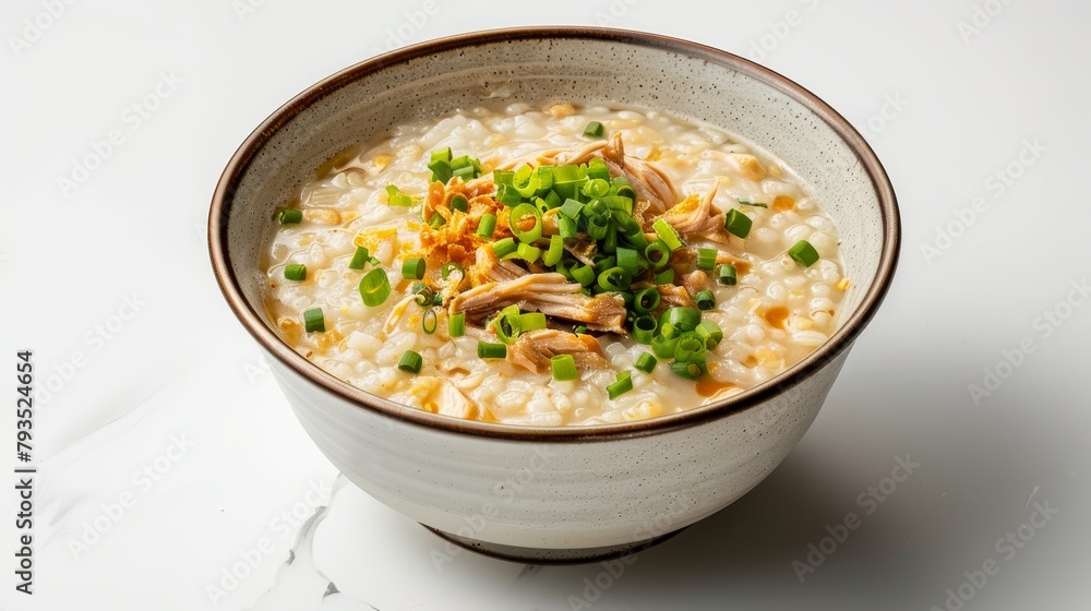Gourmet top shot of Congee, creamy rice porridge enhanced with shredded chicken and green onions, on a clean white background, studio lighting