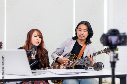 Asian musician performing rock show live at home using online platform for fan and audience at home concert and streaming broadcast network