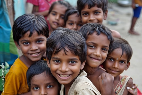 Group of indian kids smiling at camera in rural village in India