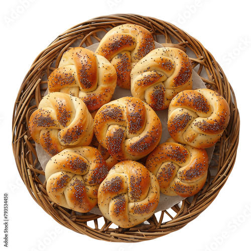 A charming display of petite braided buns sprinkled with poppy seeds artfully arranged on a rustic wicker plate set against a crisp transparent background in a top down view against a white backgro photo