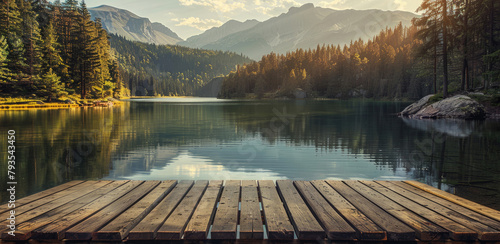 Lake in the forest with a wooden pier in front and mountains as background © Aleksandr Bryliaev