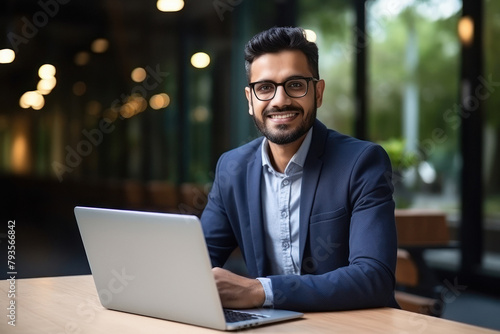 young successful businessman using laptop