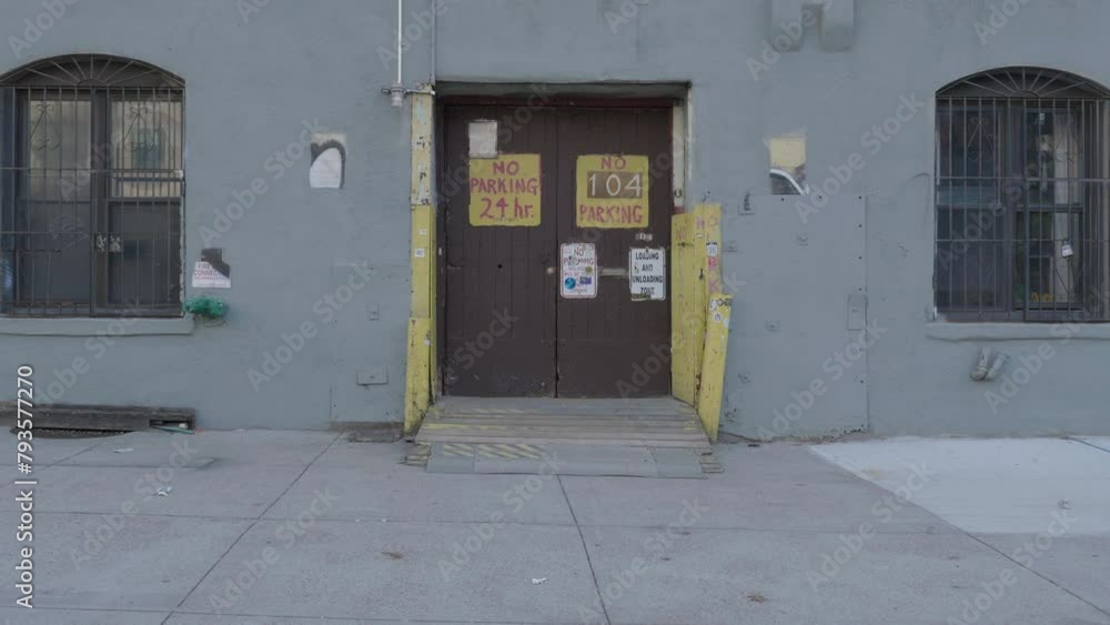 Handheld shot of a no parking sign in Brooklyn Handheld shot of a no parking sign in Brooklyn