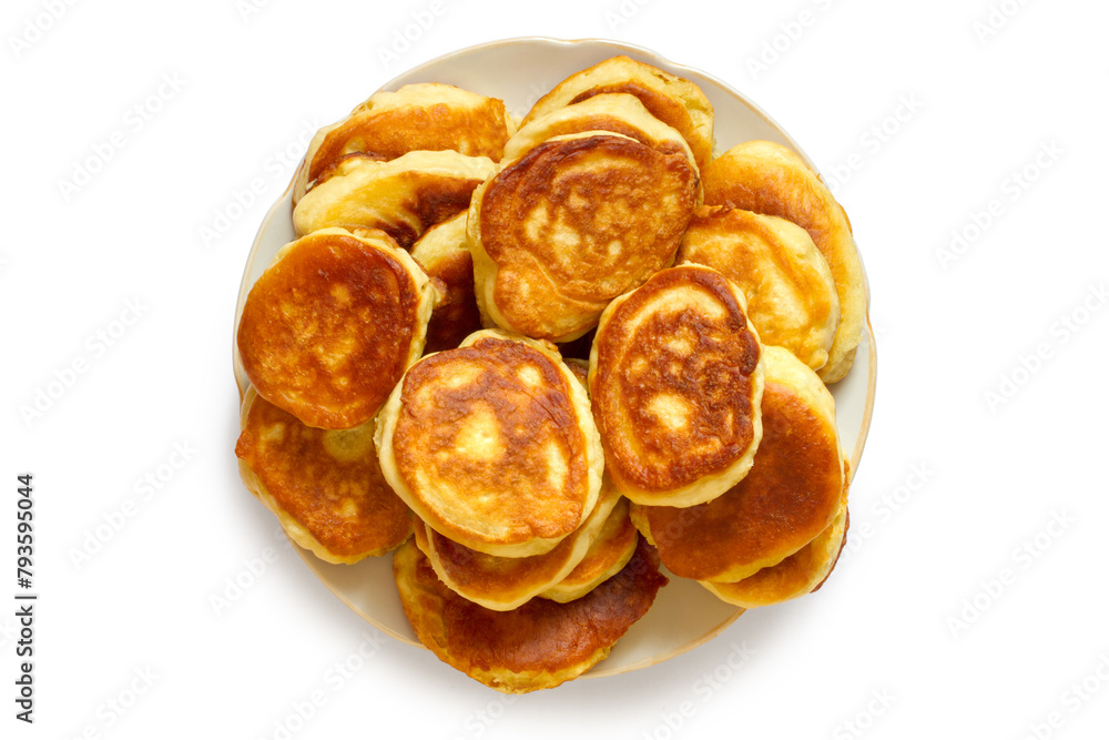 A plate of homemade pancakes on a white background. Top view. Freshly baked homemade cakes. A plate of homemade pancakes on a white background. Top view. Freshly baked homemade cakes.
