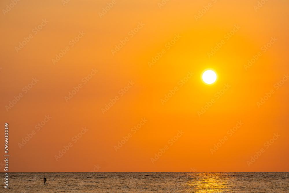 Sea view for summer vacation concept Nature of the summer beach and sea with soft sunlight. hitting the sand The sea sparkles against the sunset sky.	