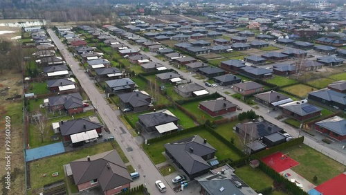 Drone view of residential houses at early spring. Lithuanian neighborhood, suburb. Real estate, drone shots, photo