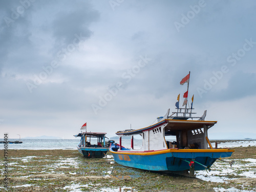 ishing boats that cannot go to sea because the water is receding photo