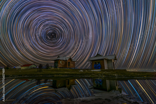 Startrail at Singalila National Park with lake photo