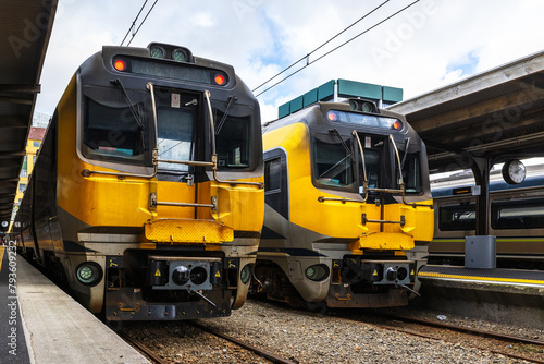An image of a train sitting at a station platform. The platform is located in Wellington, New Zealand