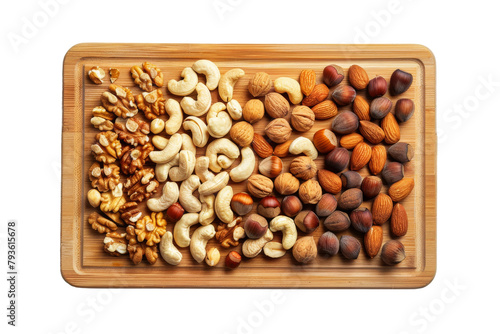 Wooden Tray Filled With Nuts on Table photo