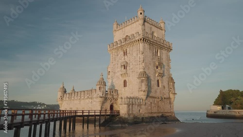 The Torre de Belem (Belem Tower) during sunrise is one of the symbols of the golden era of the Portuguese, Lisbon, Portugal