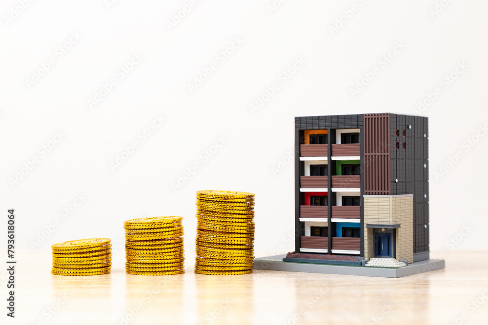 Obraz premium 住宅模型とおもちゃの金貨