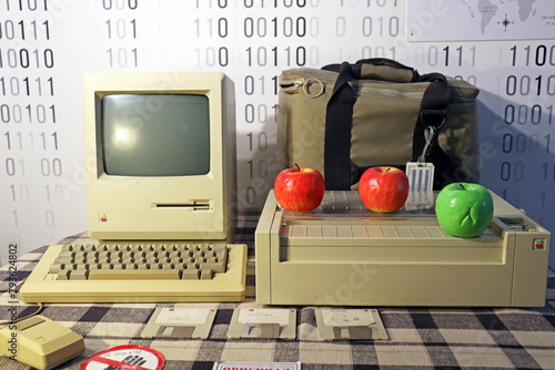 An old retro computer stands on the table. Apple and engineer technology. photo