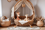 Rattan crib with baldachin, soft toy giraffe and wicker basket on rug on wooden laminate from natural materials. nursery room in boho style interior