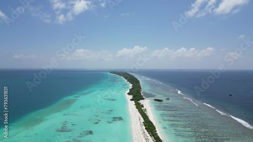 Sky blue island lagoon and tropical Sandbar beach in Dhigurah, Maldives. Aerial photo