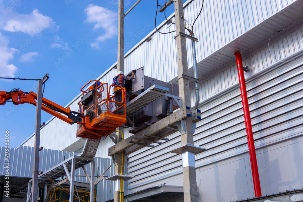 Foto de Electrical engineer working on boom lift for inspection power ...