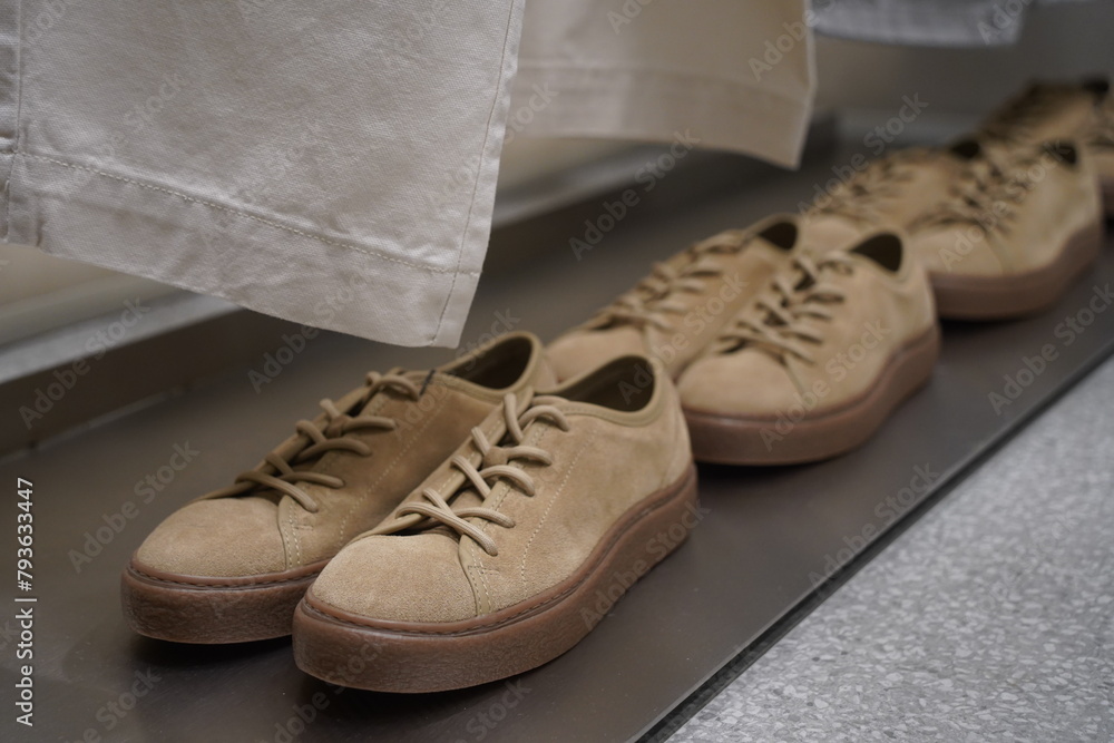 Casual suede shoes are displayed on the shelf. Casual suede shoes are displayed on the shelf.
