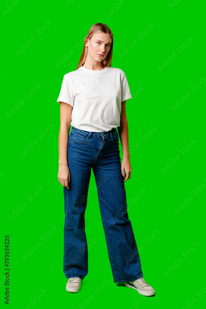 Young Woman in White Shirt Posing for Picture against green background Young Woman in White Shirt Posing for Picture against green background