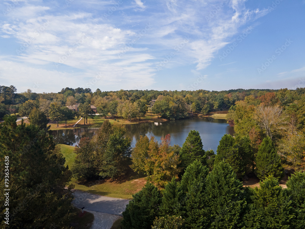 Aerial sunset landscape of forest and lake in rural neighborhood CSRA Grovetown Augusta Georgia