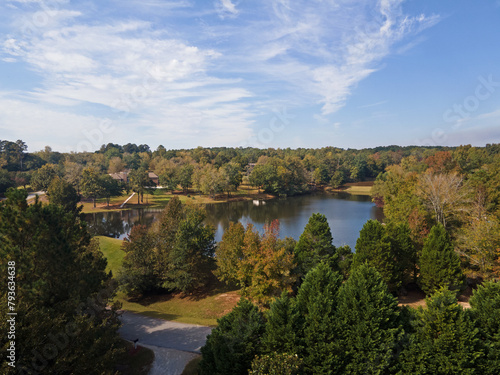 Aerial sunset landscape of forest and lake in rural neighborhood CSRA Grovetown Augusta Georgia